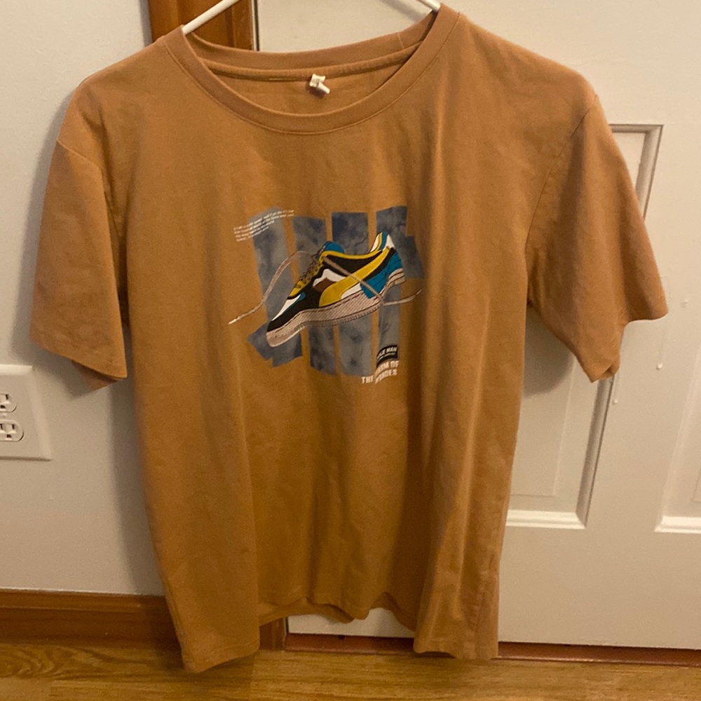 A off-white tan t-shirt form Dubai